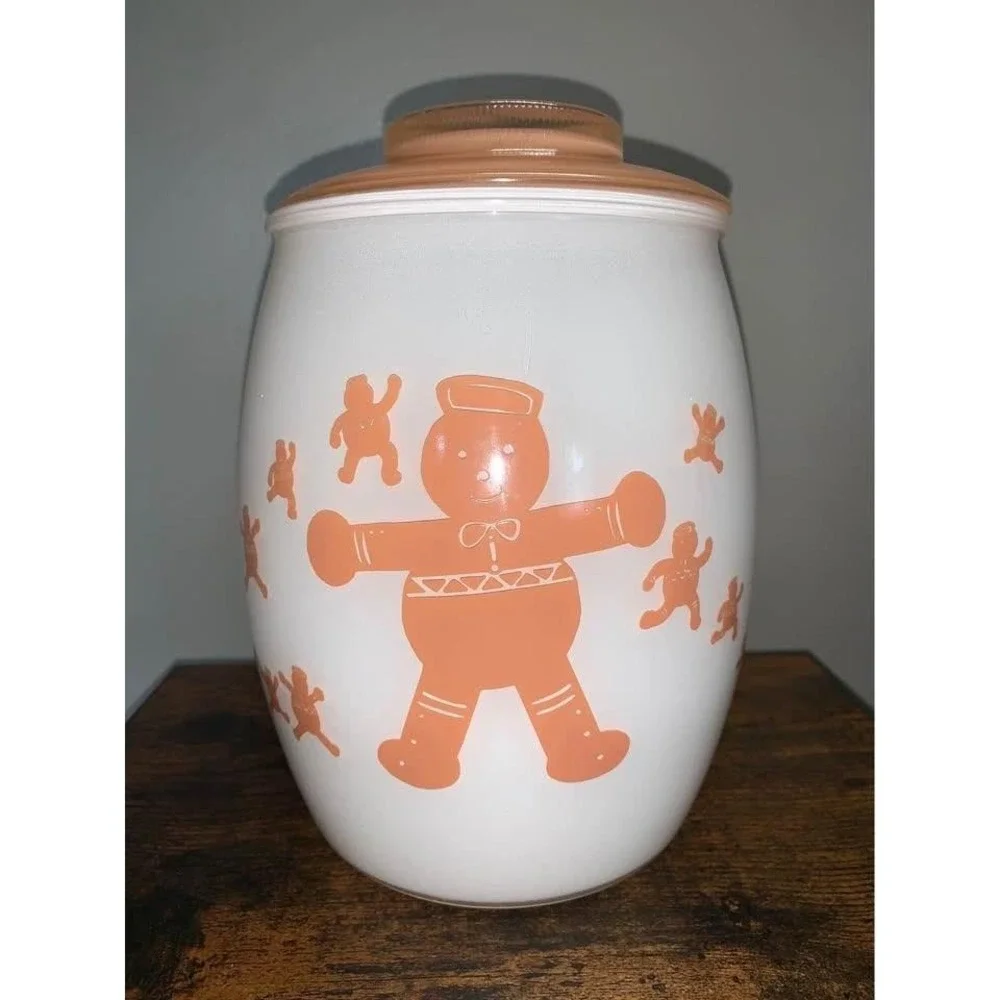 Vintage Bartlett Collins milk glass cookie jar featuring gingerbread man design